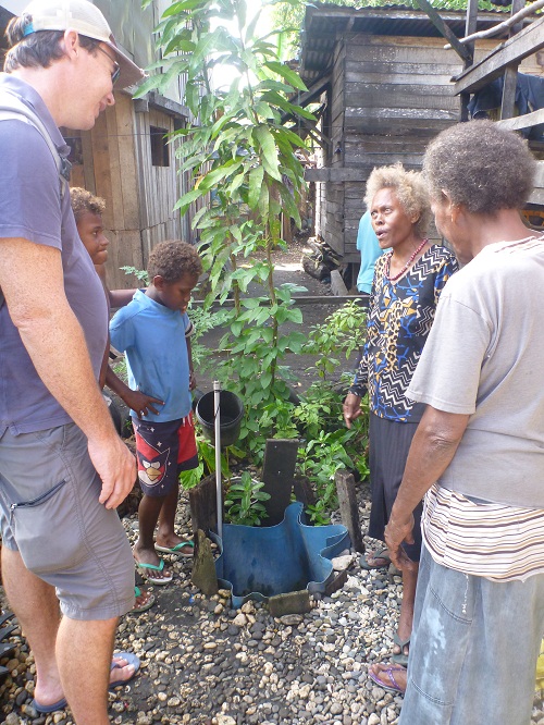 Mary Noela Bibi shows Dr Simon Albert a domestic non-drinking water source in her community adjacent to Mataniko River