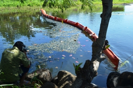 Working together to place booms at rivers