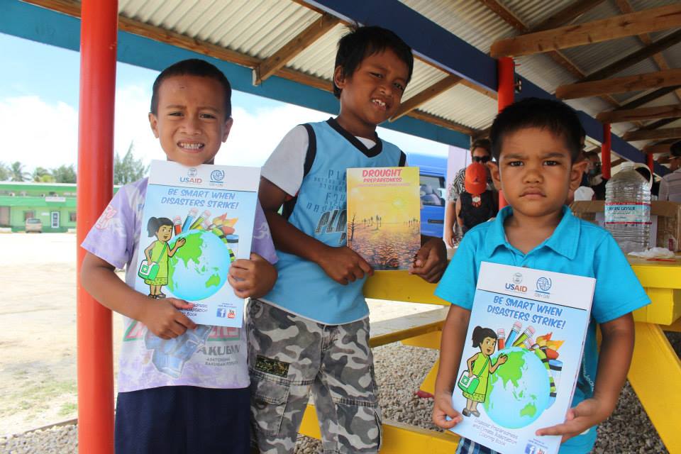 cool dudes USAID give away comic books