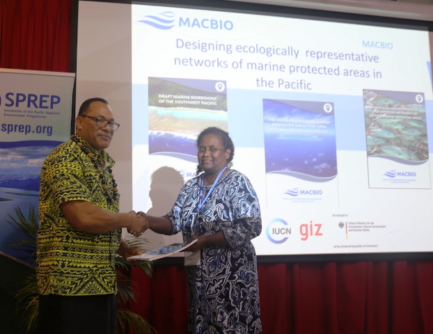 Agnetha Vave-Karamui, Solomon Islands recieves the report from SPREP