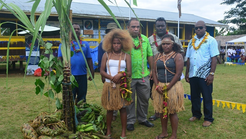 Guests at the celebration of World Environment Day in Barana (back row, left to right), Barana chiefs, Permanent Secretary, Dr Mataki, PEBACC Country Manager, Mr Fred Patison, Guadalcanal Premier, Mr Anthony Veke and (front row) garlanding ladies from Barana community