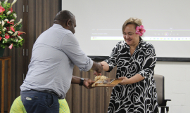 PMC Chair, Mr. Levu Antfalo presenting their gift to Tagaloa Cooper