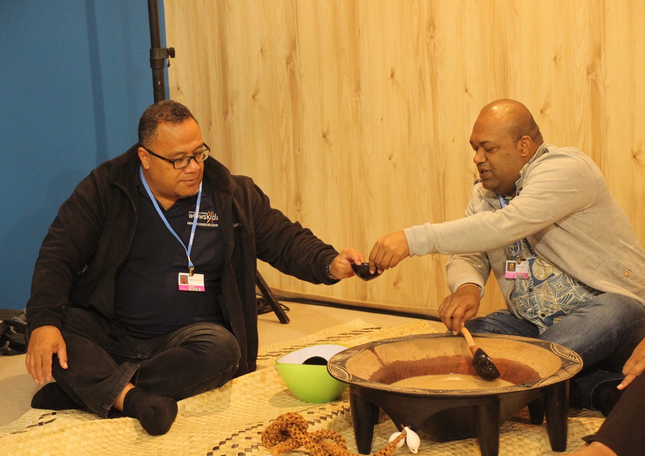 Taholo Kami and Fiji delegation serve Kava in the Pacific and Koronivia Pavilion